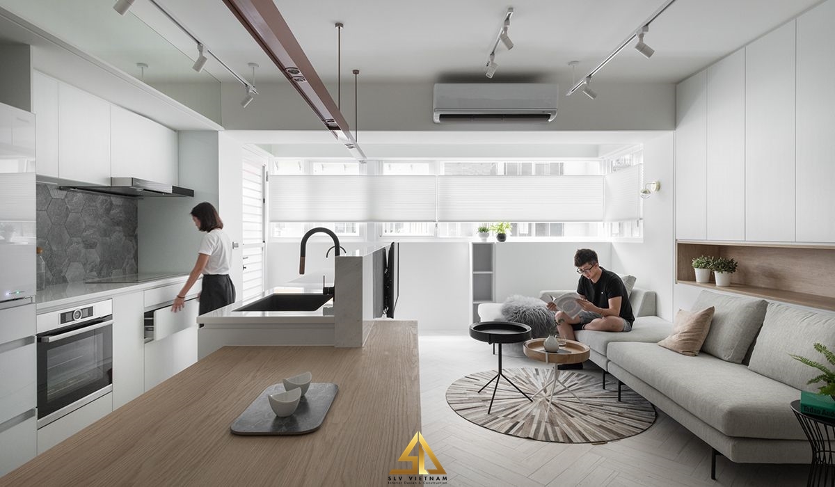 Vách ngăn phòng khách và phòng bếp tích hợp khu vực chế biến thực phẩm.